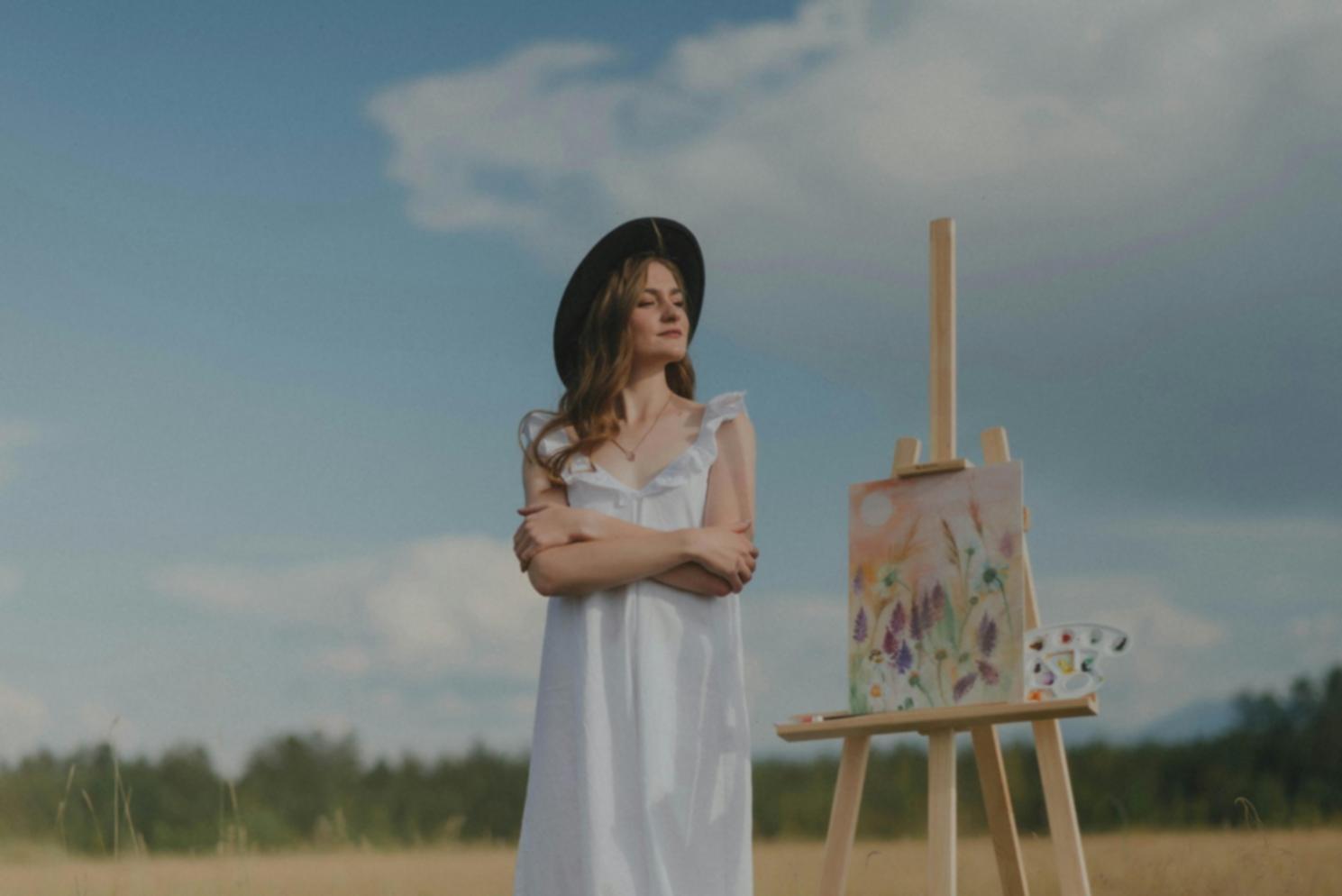 Student working on digital painting with focused attention